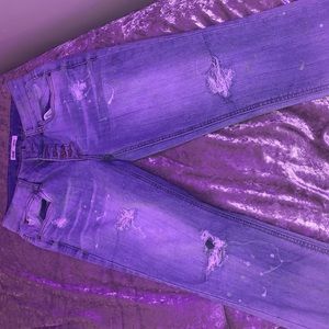 Jeans with paint splatters and rips